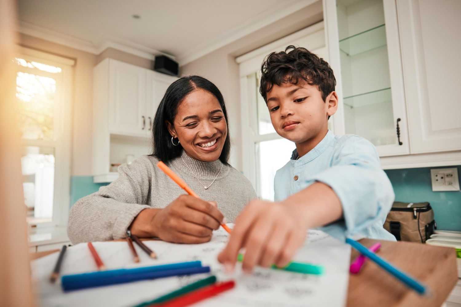 Parent guiding child’s learning with ABA strategies